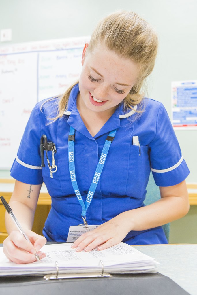 hospital nurse making notes