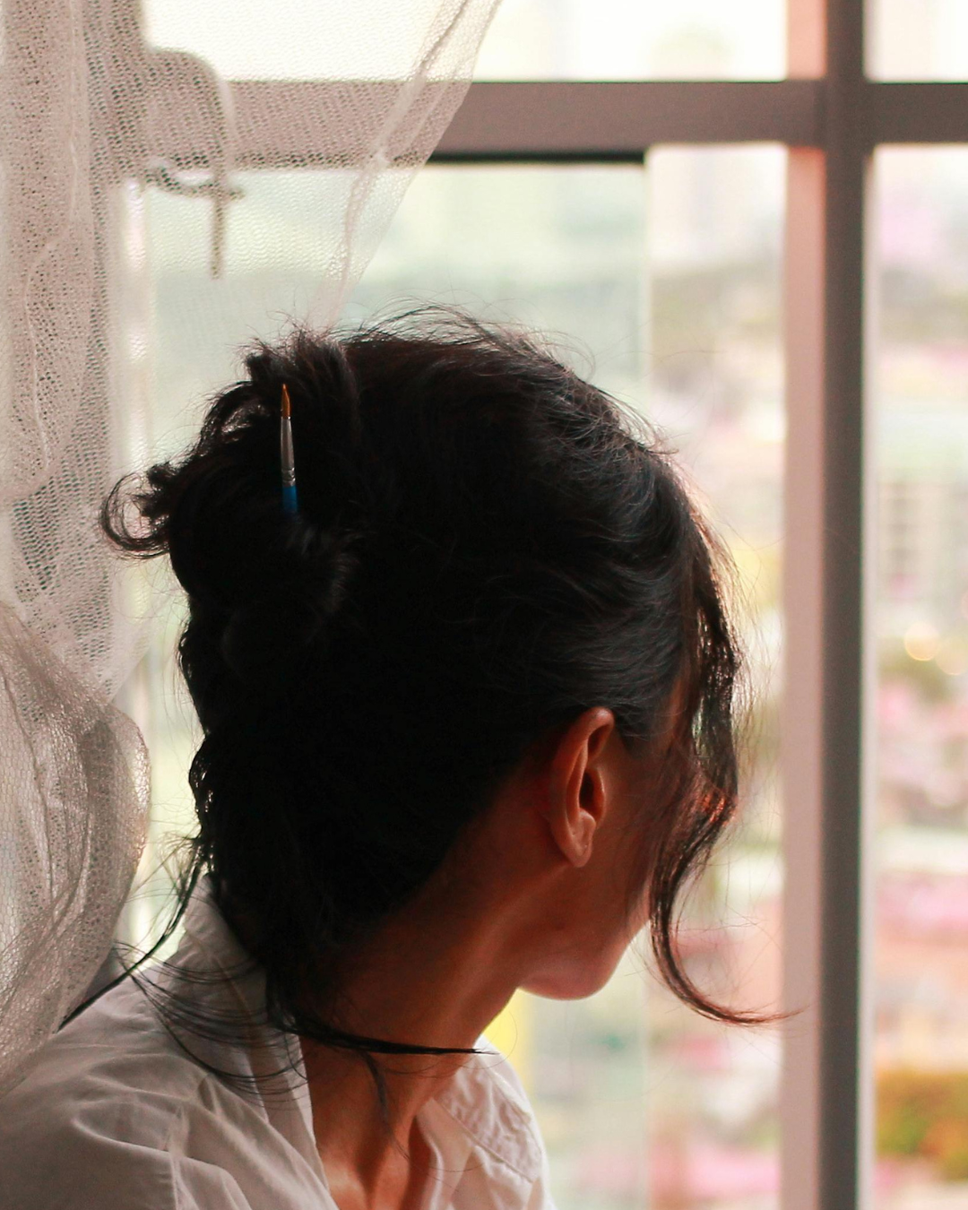 woman looking out of window.png