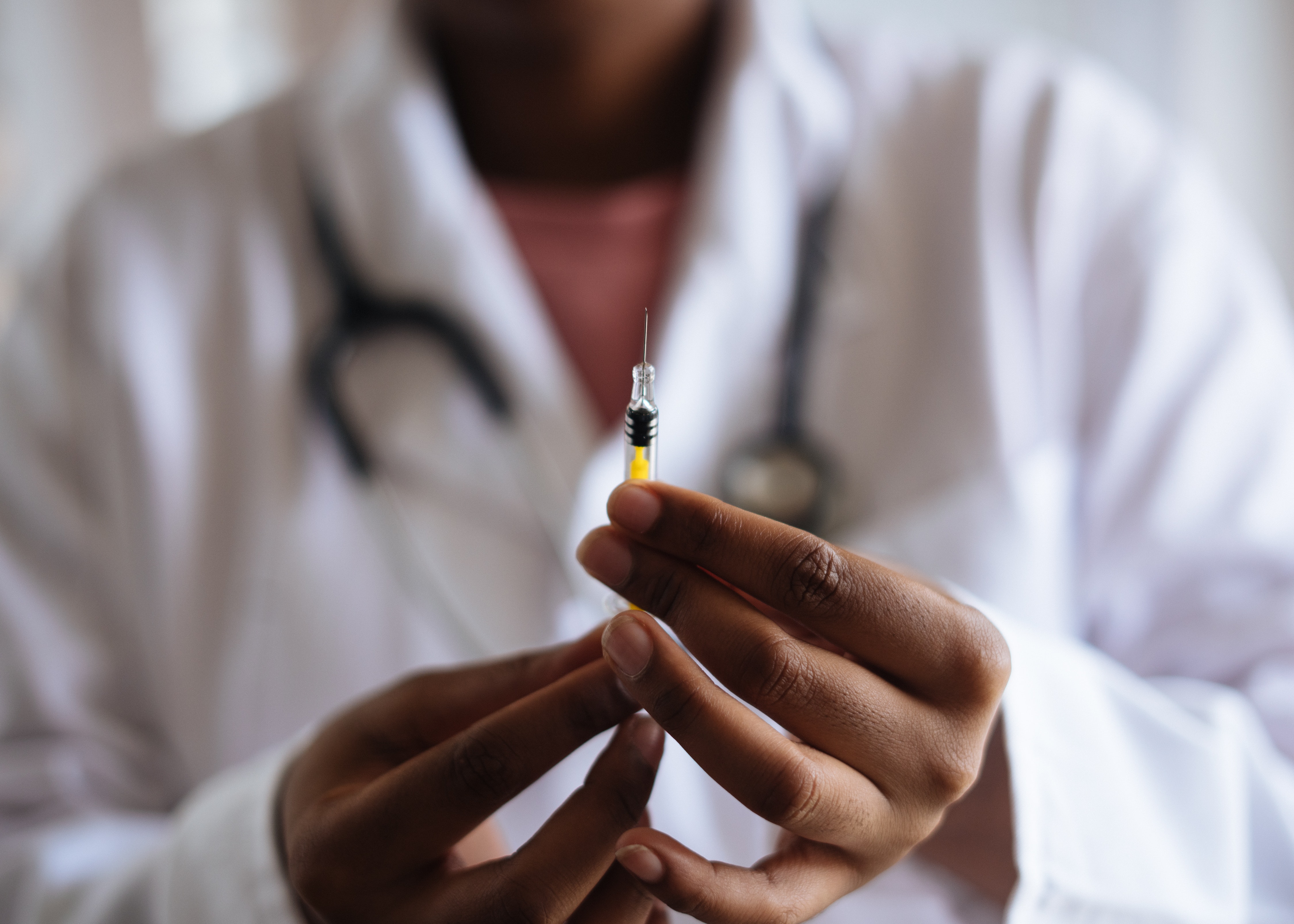 Nurse holding a syringe