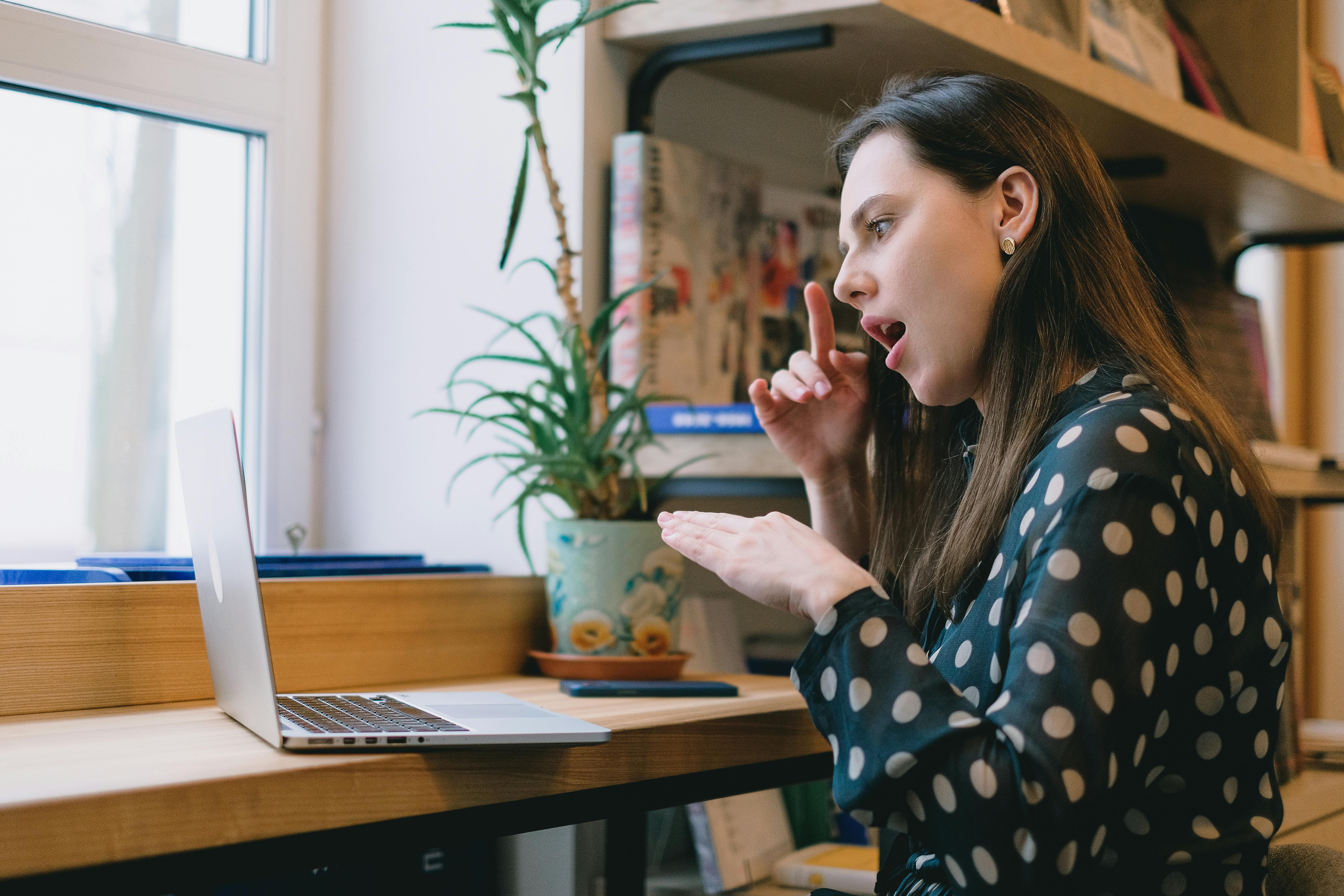 free image of deaf or hearing impaired person on laptop signing.jpg