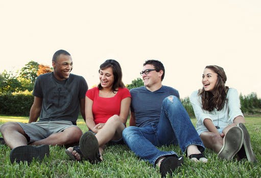 teenagers sat in a park 