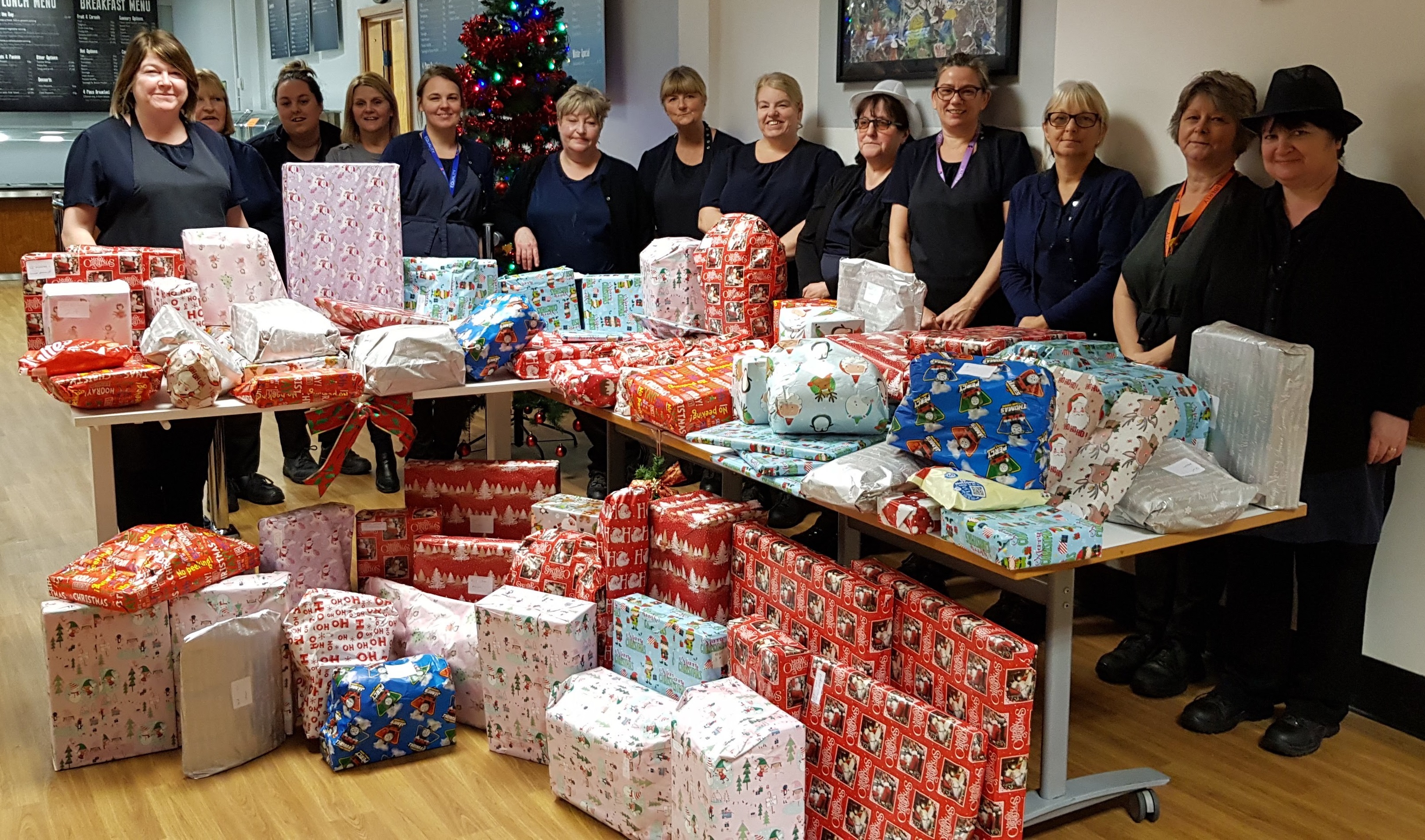 Catering team donates Christmas presents for needy children