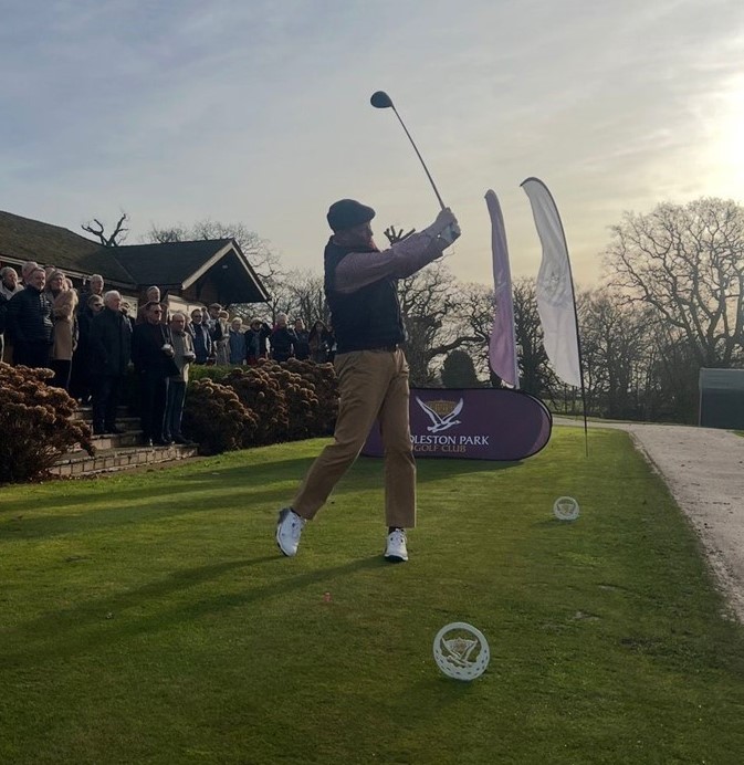 Golfer hitting a shot from the tee