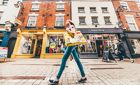 woman walking through Derbyshire high street