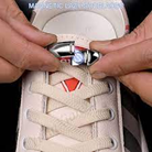 a person clipping the magnetic laces together
